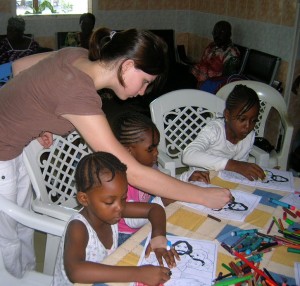 Natalie helping the kids to colour