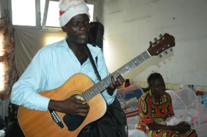 Etienne singing Gospel songs to encourage patients in General Hospital