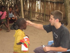 Mike giving orphans vitamins back in 2009