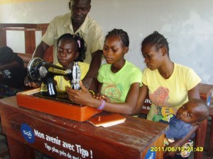 single mothers and orphaned girls learning tailoring