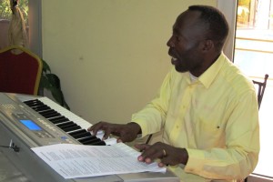 Thierry at the keyboard leading praise and worship