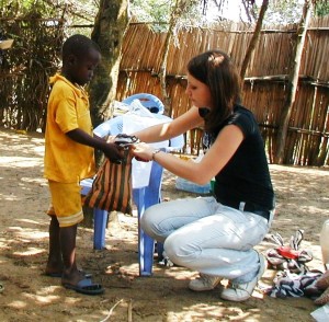 Natalie distributing food packages to orphans back in 2009