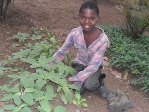 Orphaned girl tending to her garden