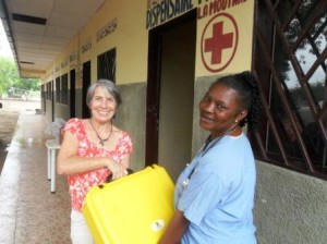 Clotilde offering Maternity kit to Florence