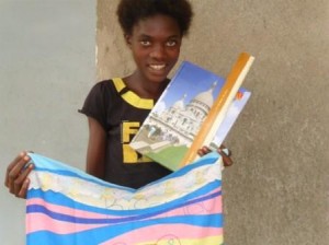 1b.17_orphaned girl proud of her first tailoring achievement