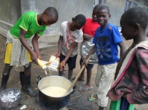 6.7_Orphaned kids happy to prepare donated cereal for breakfast