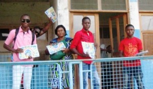 3_Grace wife of Thierry and his Bible students at General Hospital with posters and magazines