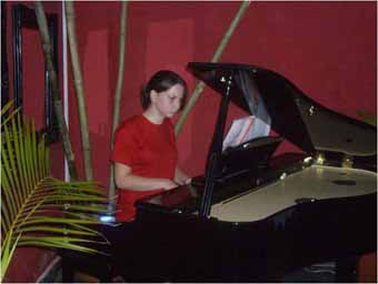 Playing piano at the Sai Sai Club