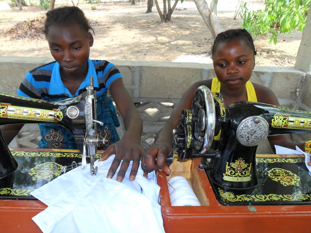Our tailoring students stitching the uniforms