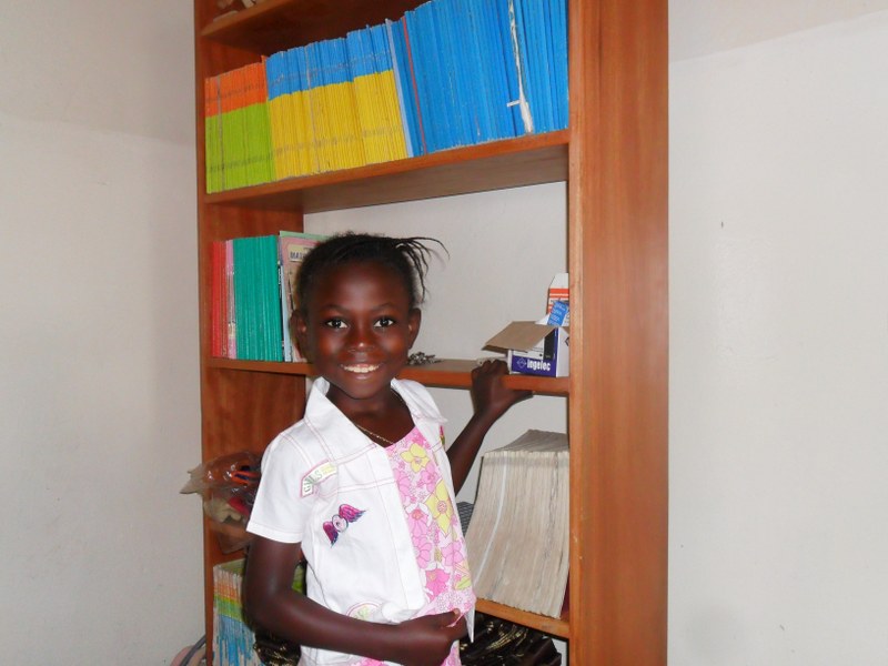 Orphaned girl Fatu so happy to have access to the library