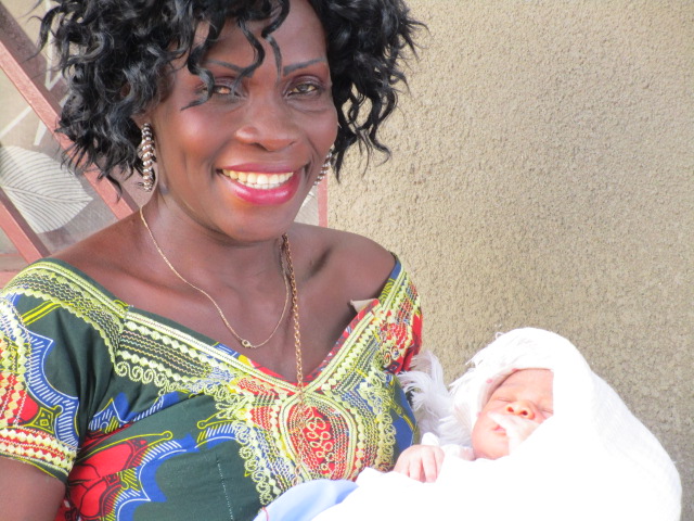 A happy mommy with new baby born in Kikimi