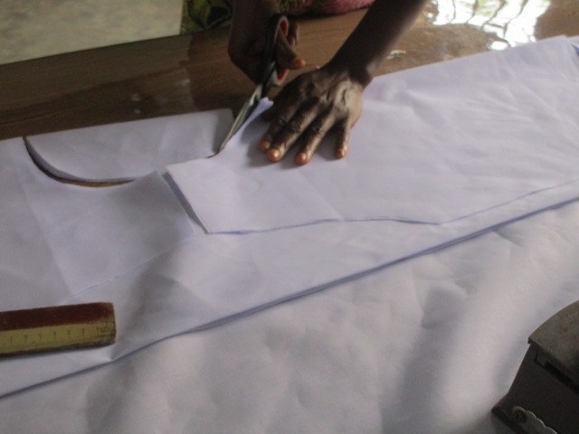 Pre-cutting the materials for the students to stitch.