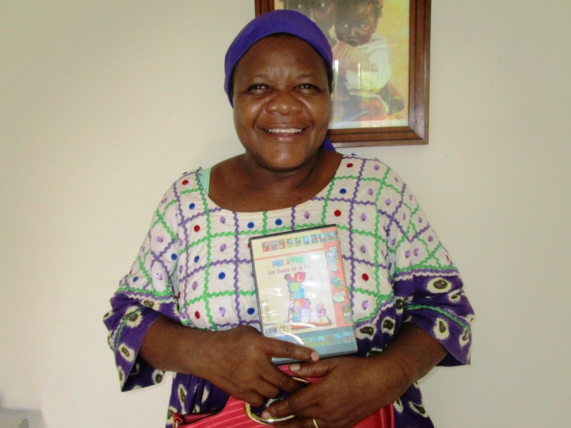 Justine, Sunday School teacher, so happy to be receiving the STEPS Program in French!