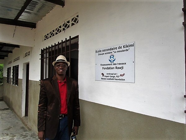Professor Mossai from the Rawji Foundation in front of the high school