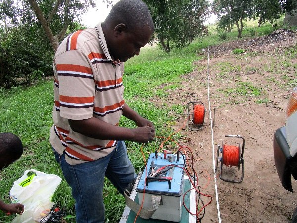 Engineer doing the geo-electric testing during the field survey.