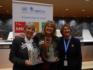 Clotilde receiving award from WFO's president, next to South Africa representative