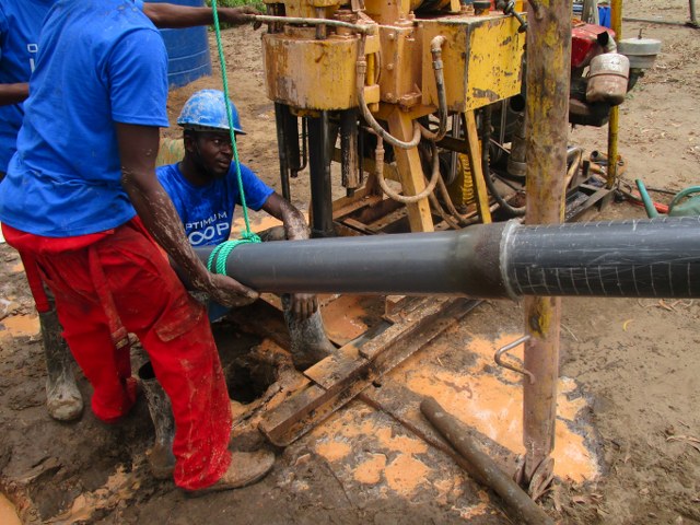 Installing bore well pipes once water was reached
