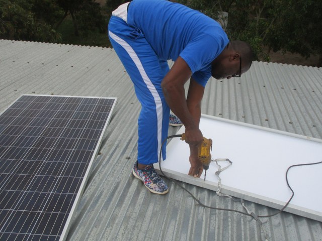Installing photovoltaic panels on the roof.