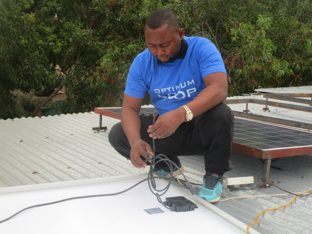 Installing photovoltaic panels on the roof.