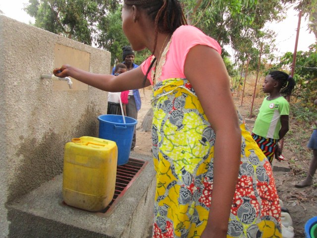 Women fetching clean water at our fountain.