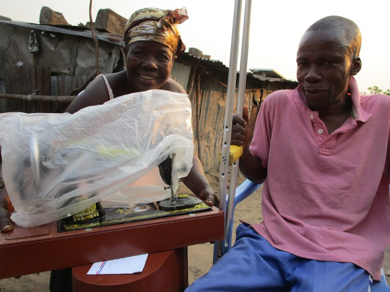 Our handicapped laureate receives a sewing machine from Mohammed and Katherine to start his own tailoring business