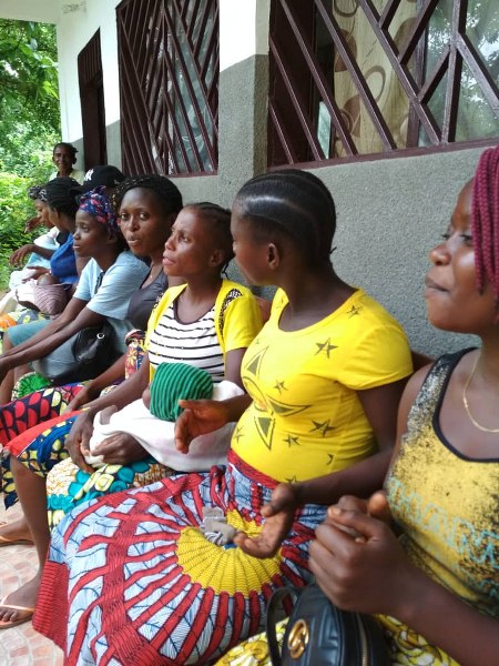 Women singing while waiting for postnatal care