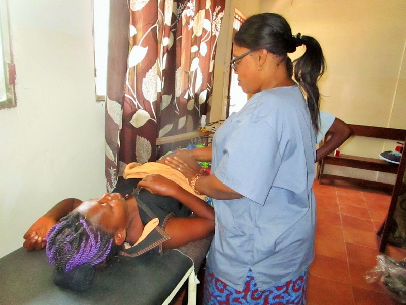Florence giving pregnant mother pre-natal checkup